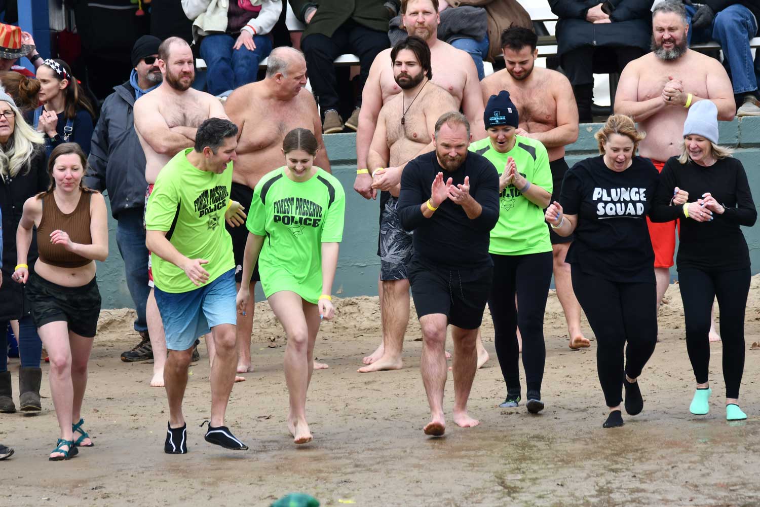 People stand on a beach