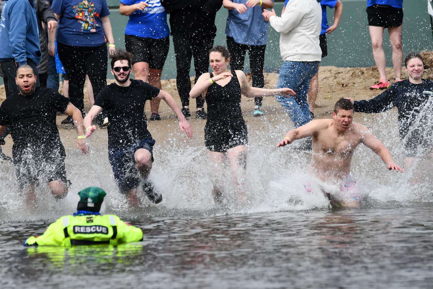 People dive into water