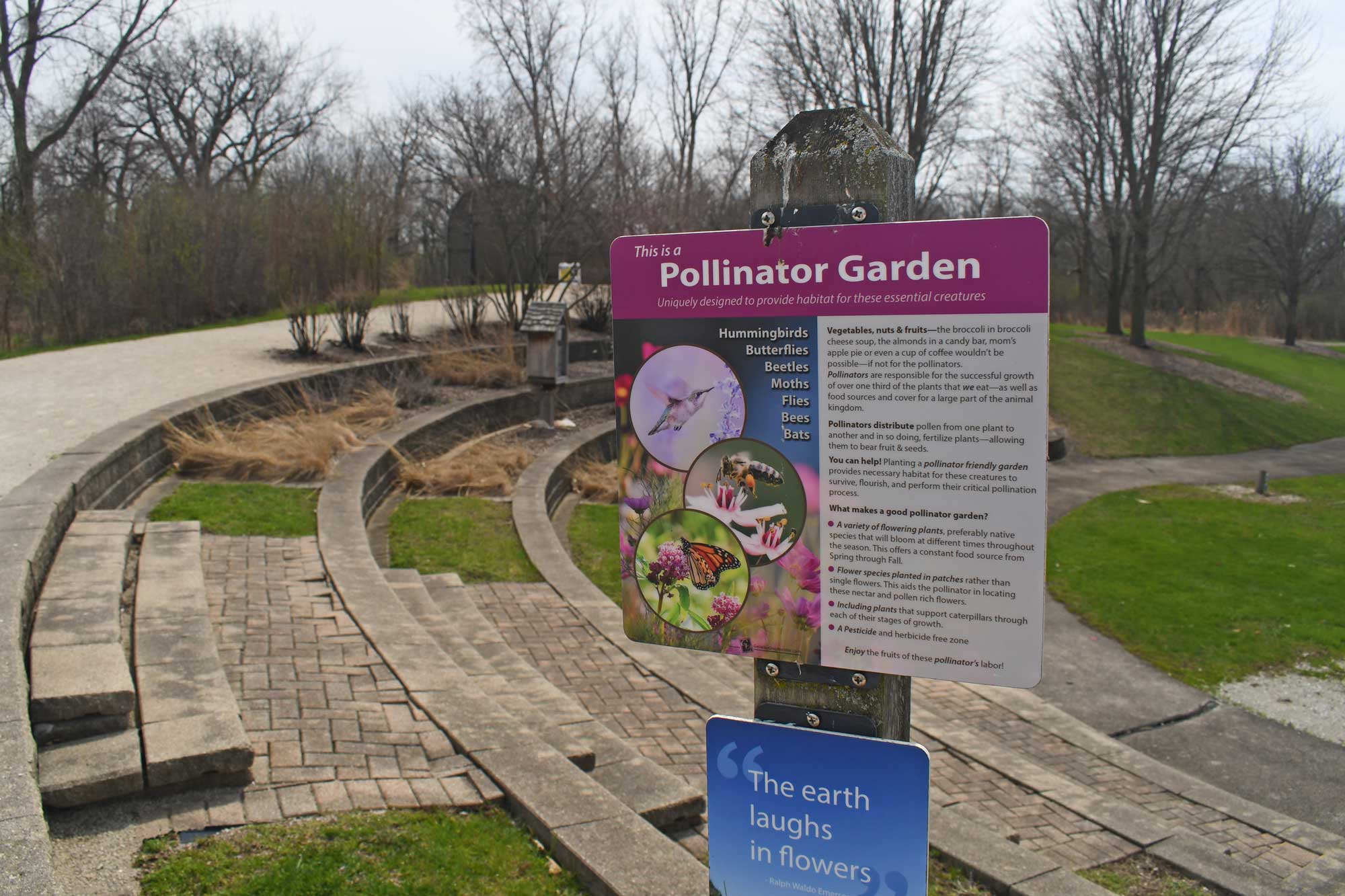 Signage in front of pollinator garden.