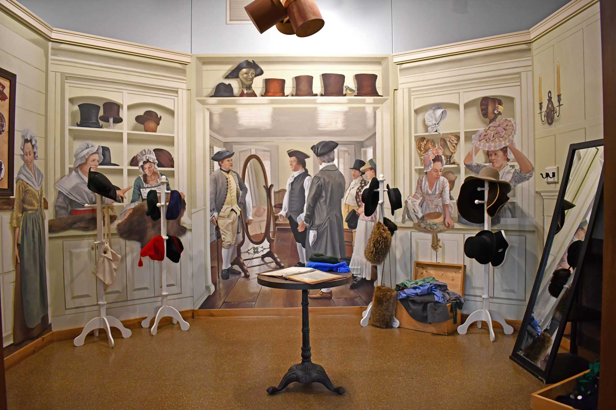 Painting of a historical scene with colonial clothing on display.