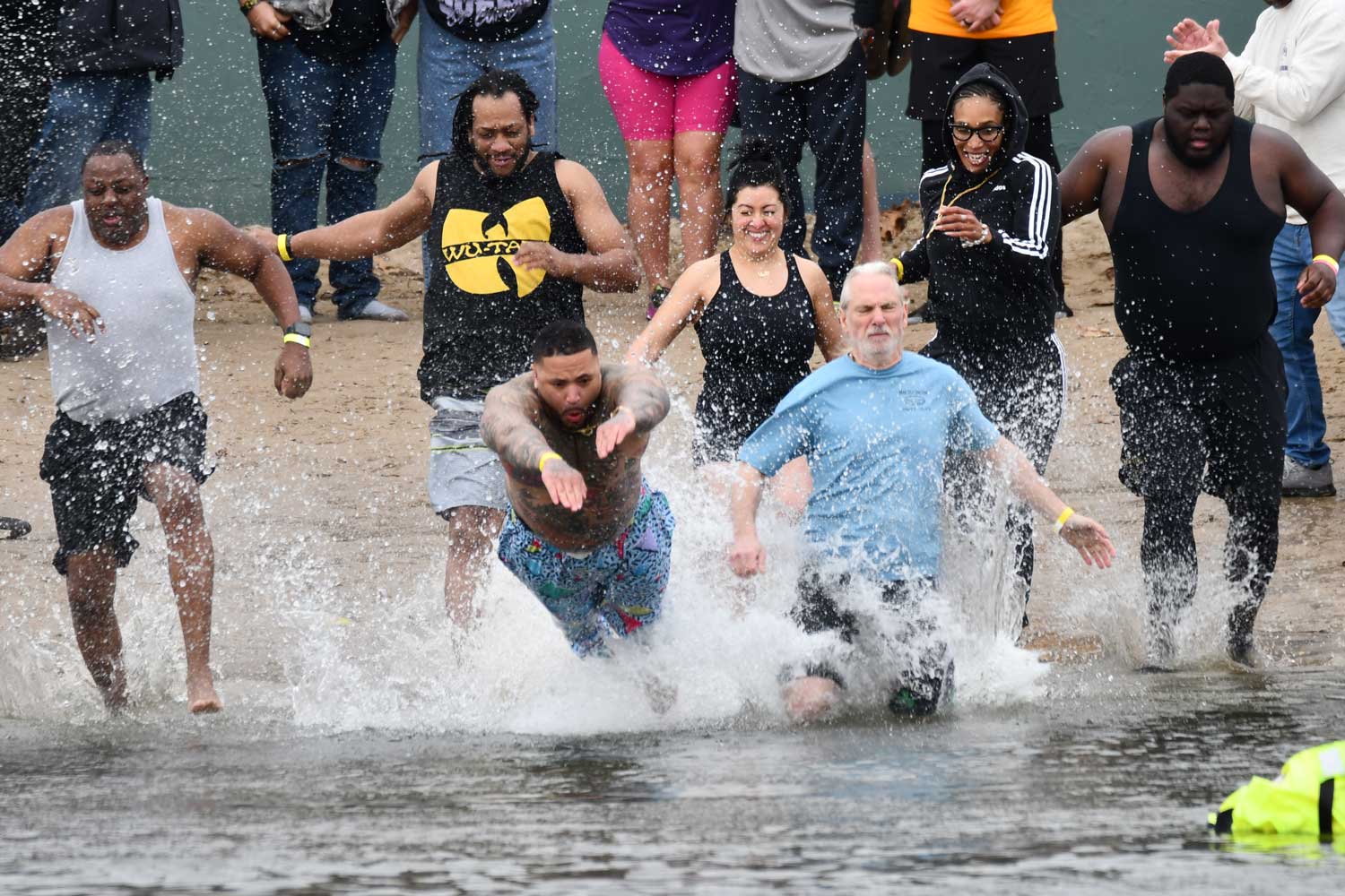 People dive into water