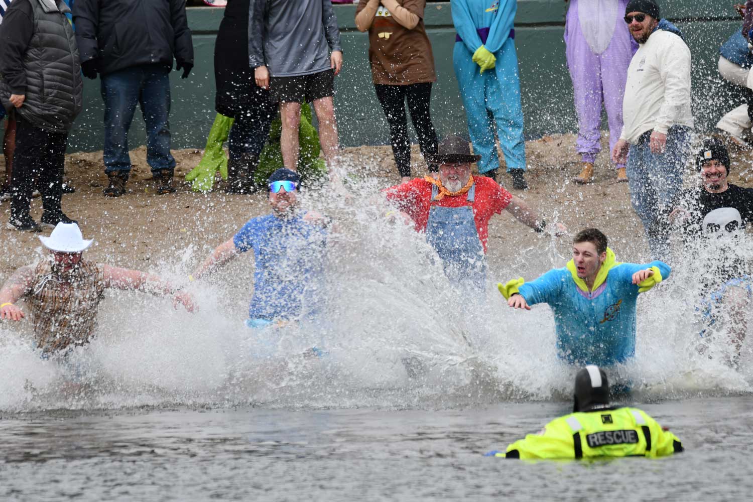 People dive into water