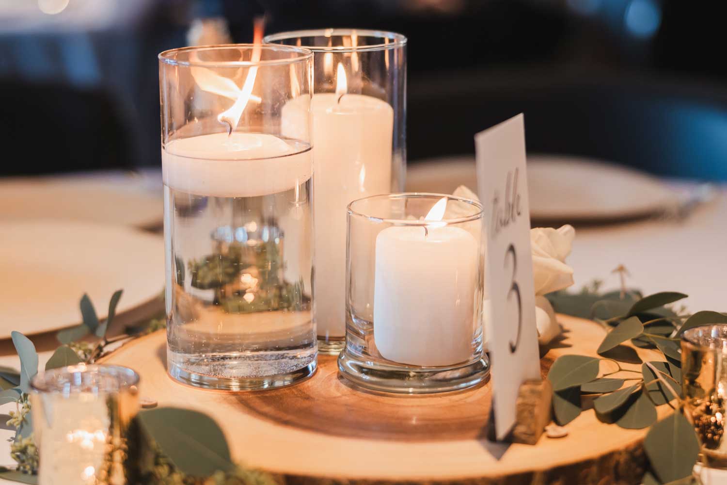 Table arrangement set up on table at wedding.