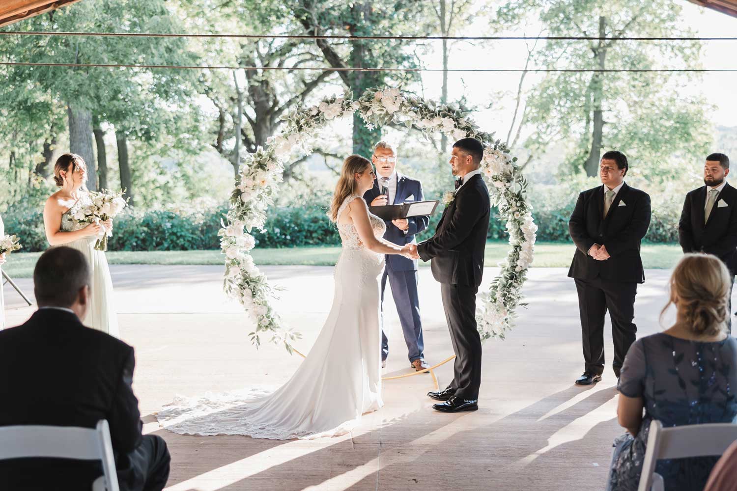 Couple standing at the front of a wedding during the ceremony.