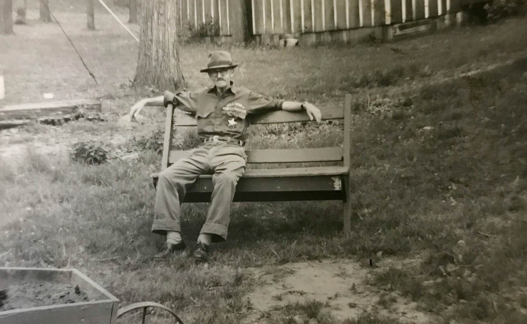 Arthur Sage sitting on a bench.