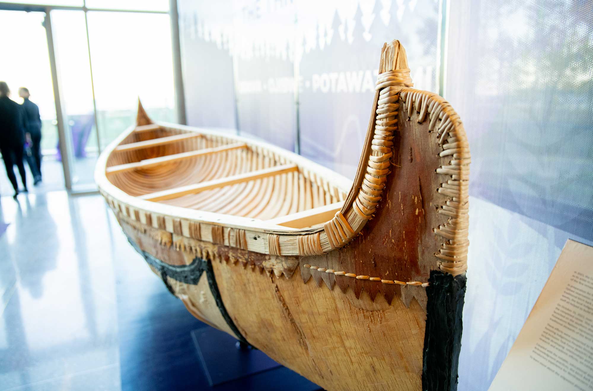 A historic bark canoe on display.