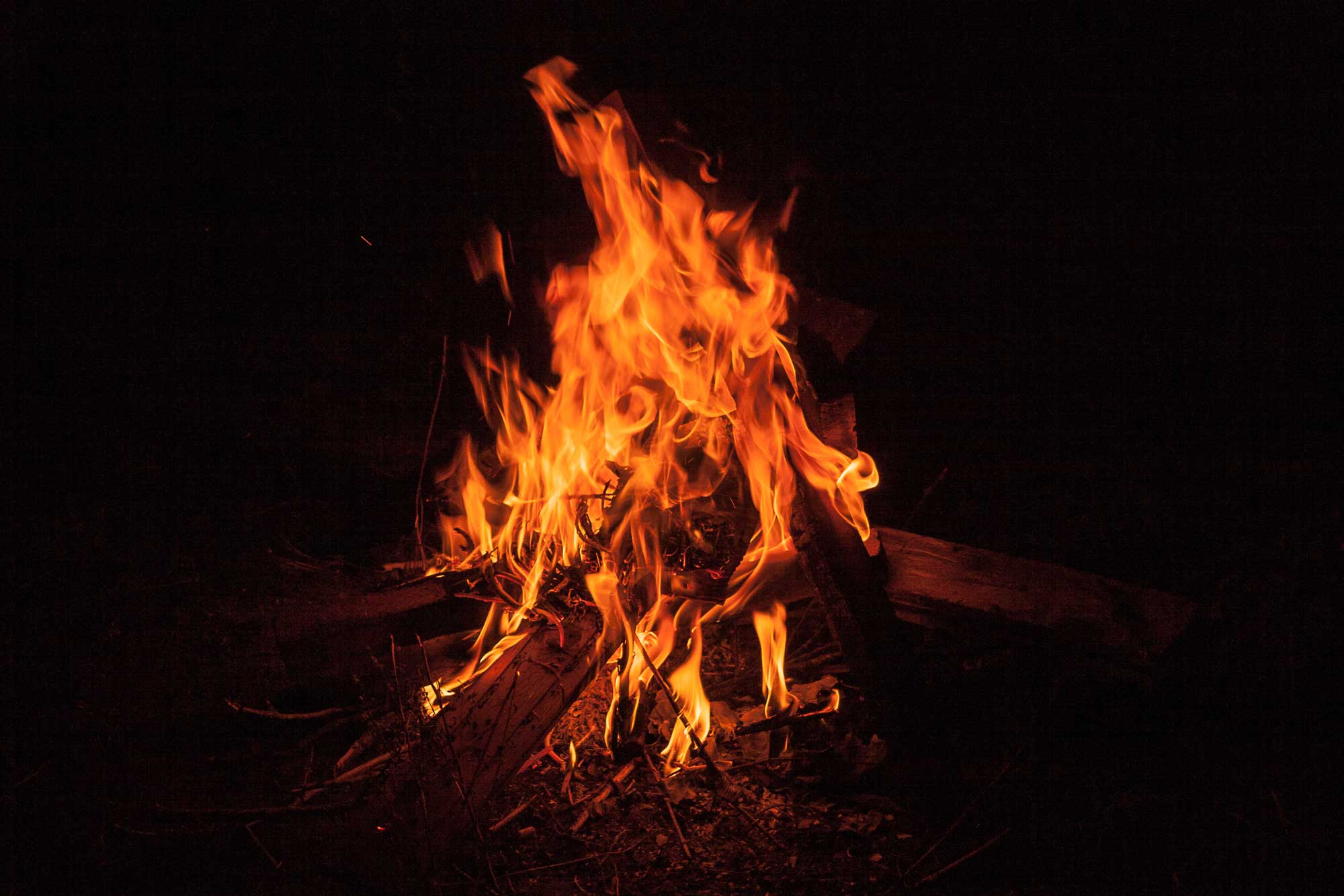 A blazing bonfire in the dark.