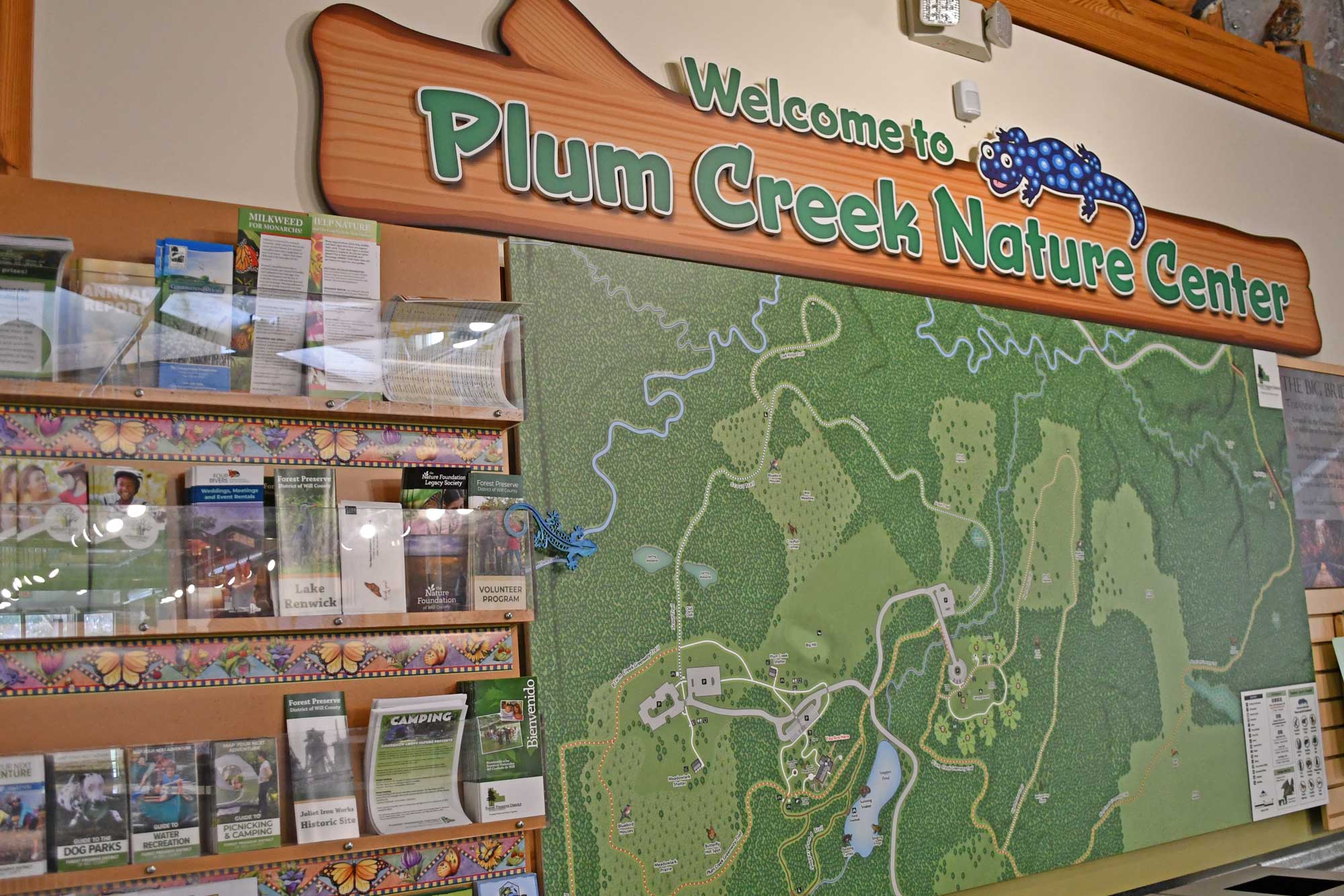 Map of nature preserve next to informational brochures.