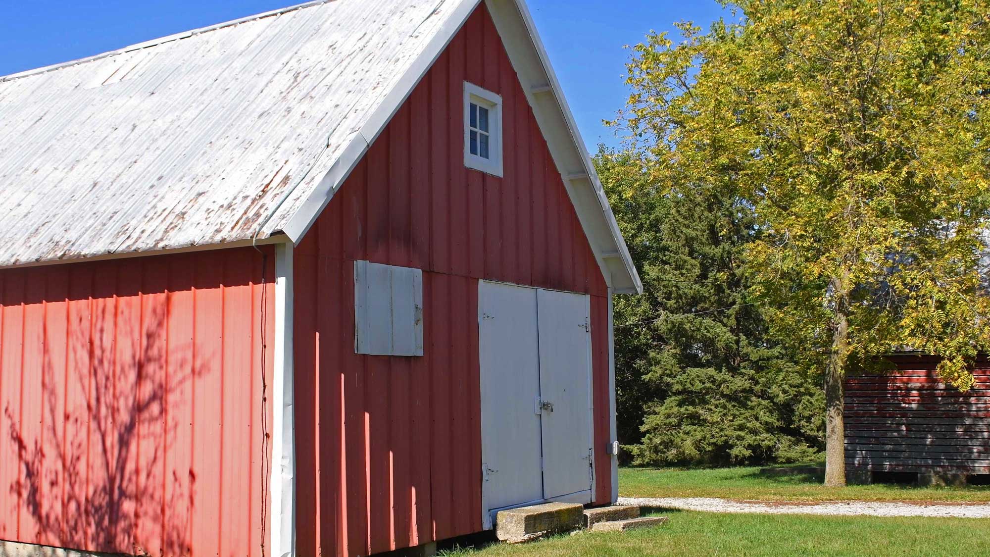Granary standing with trees in the background.