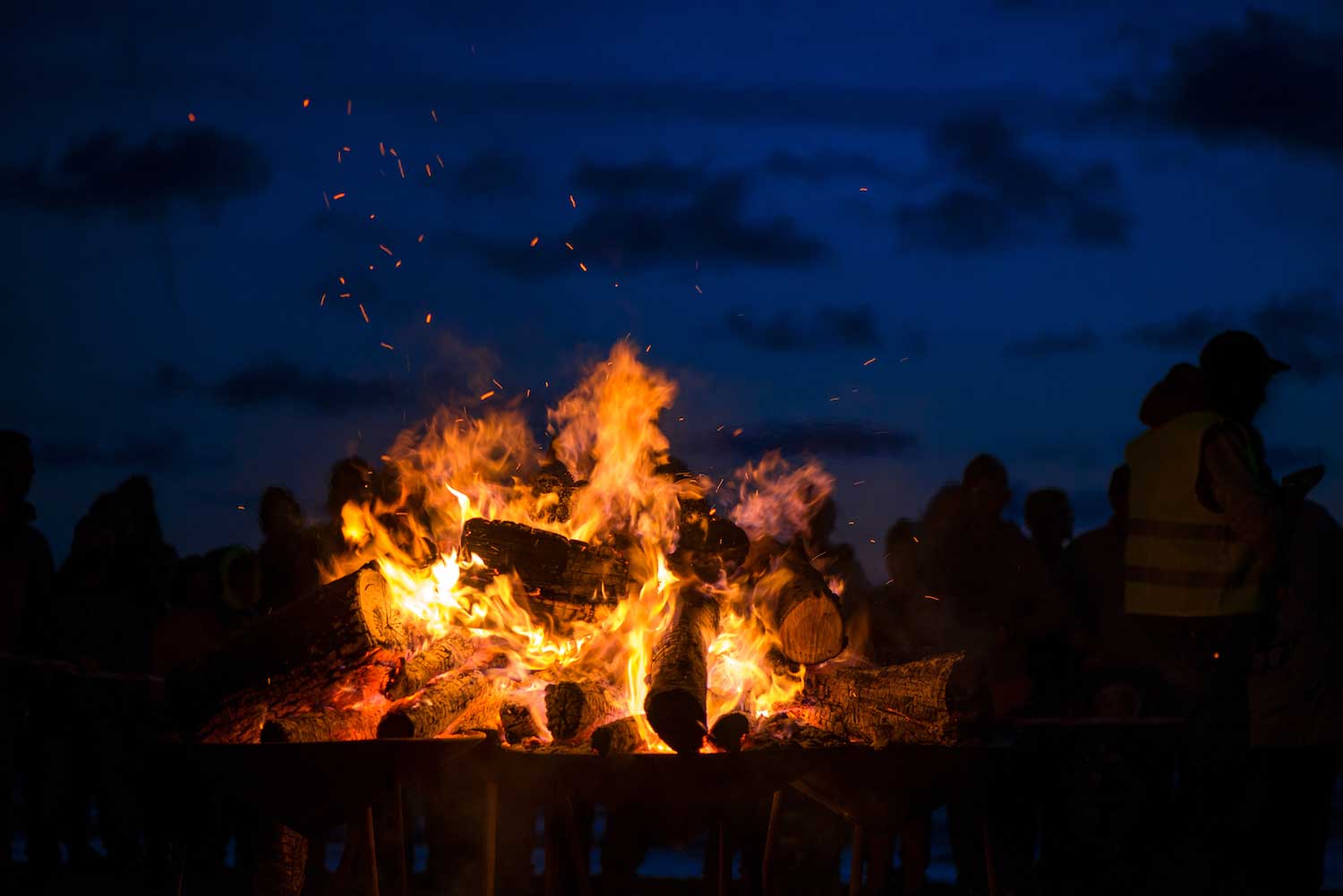 A bonfire burning in the dark.