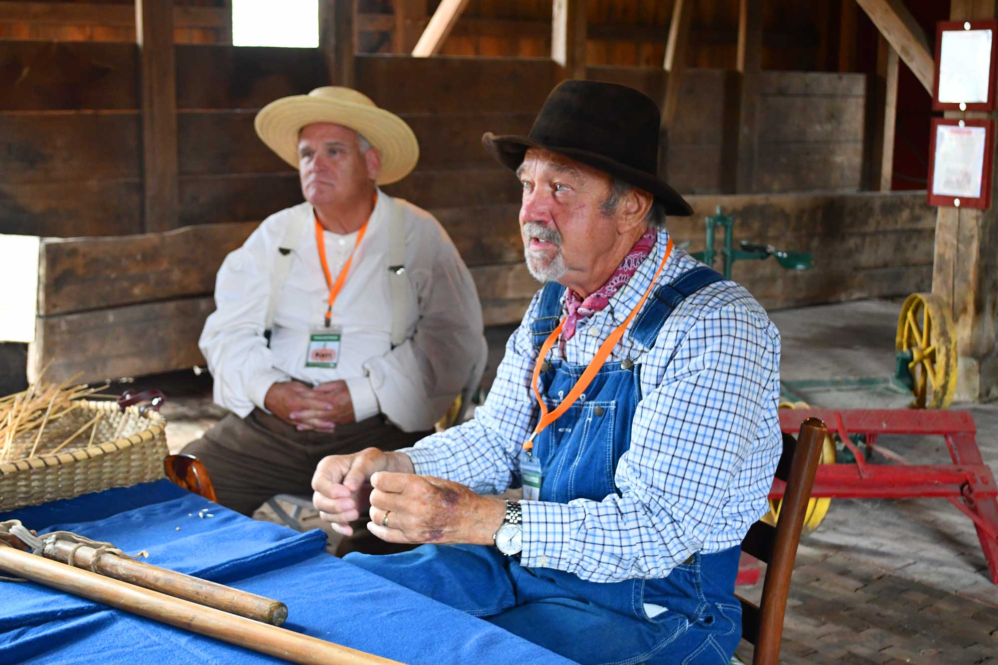 Two people dressed up for historical reenactment at a program.