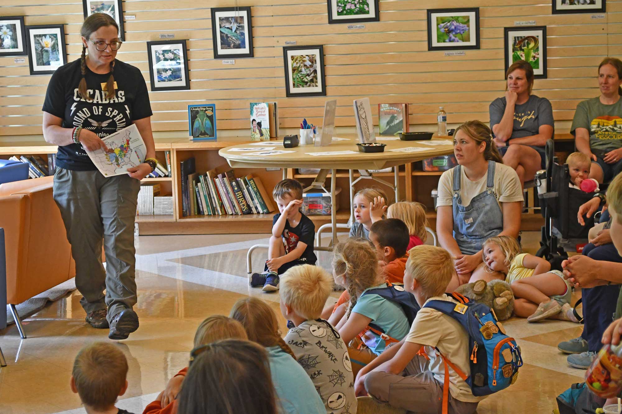 Staff member conducting program with kids.