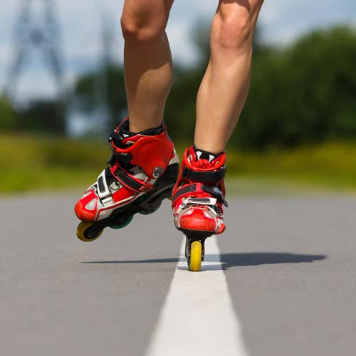 A person in roller blades on a trail.