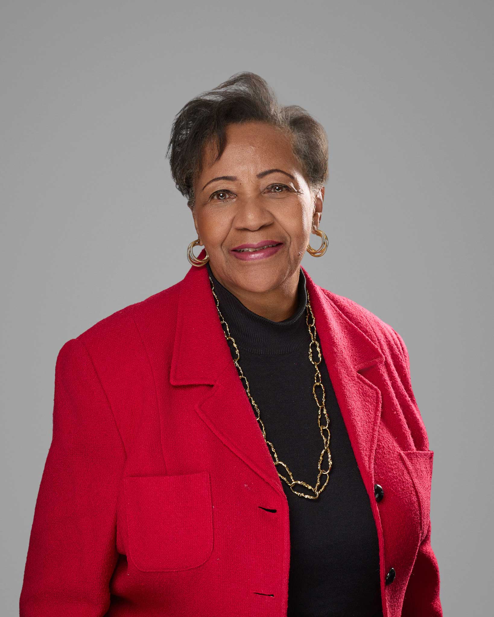 a woman in a red jacket