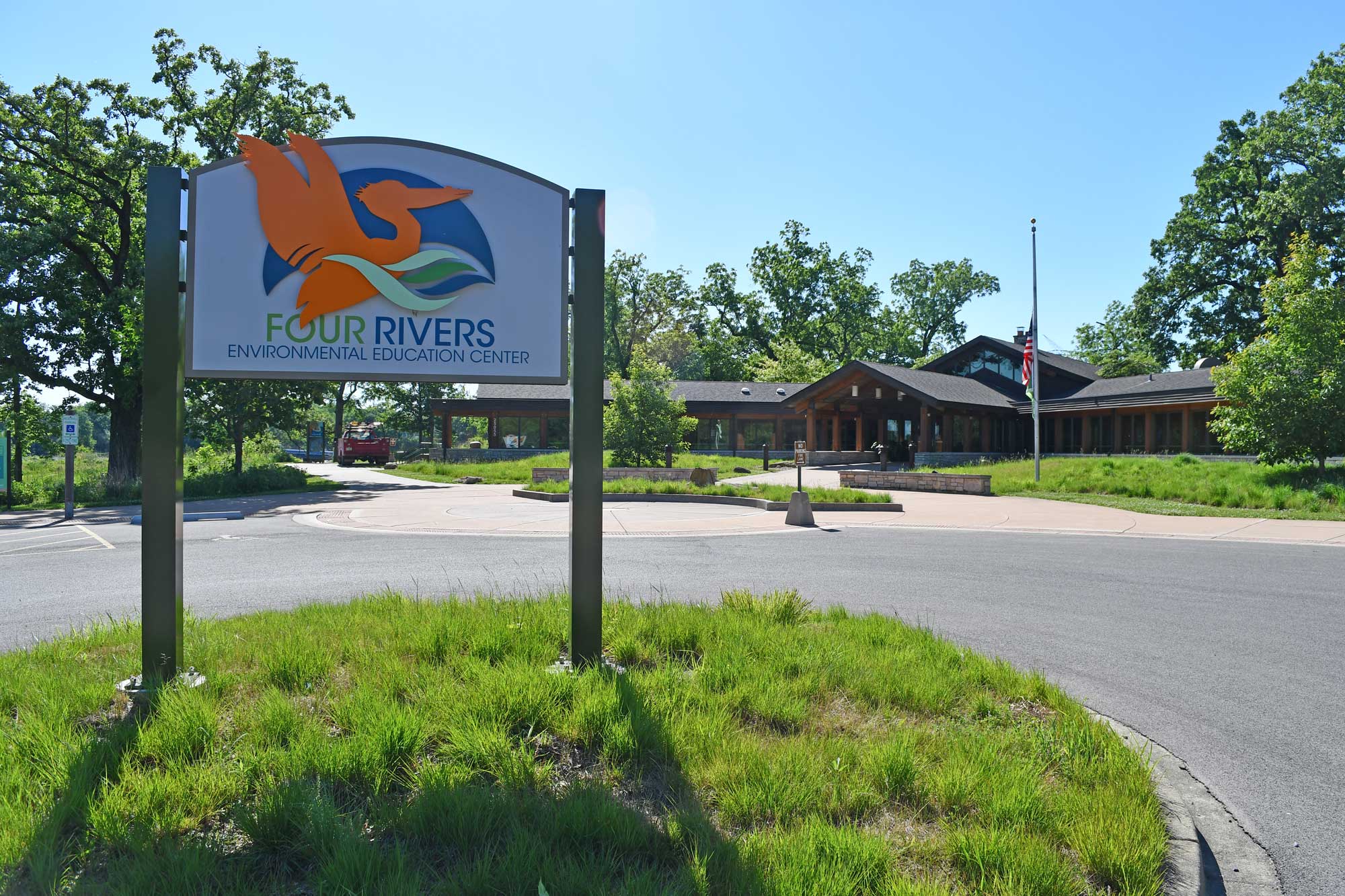 Nature center sign in front of building.
