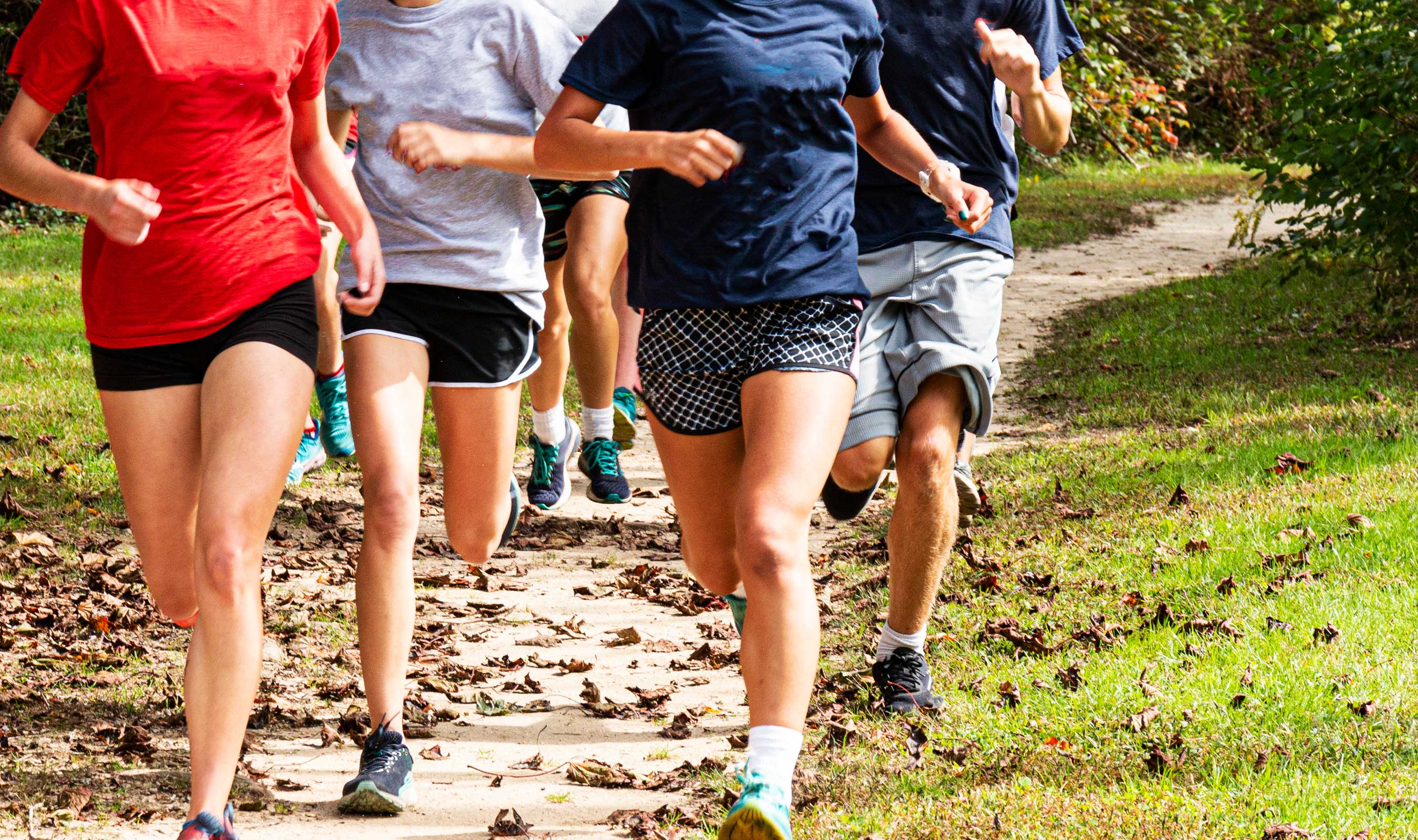a group of people running on a trail