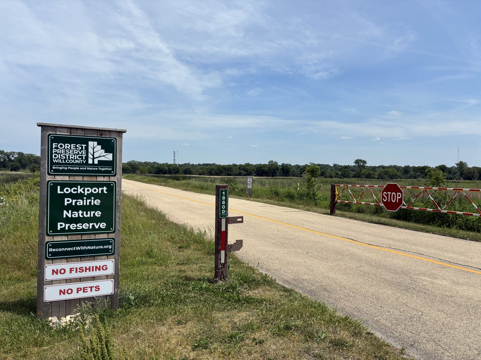 Preserve sign by entrance road and gate.