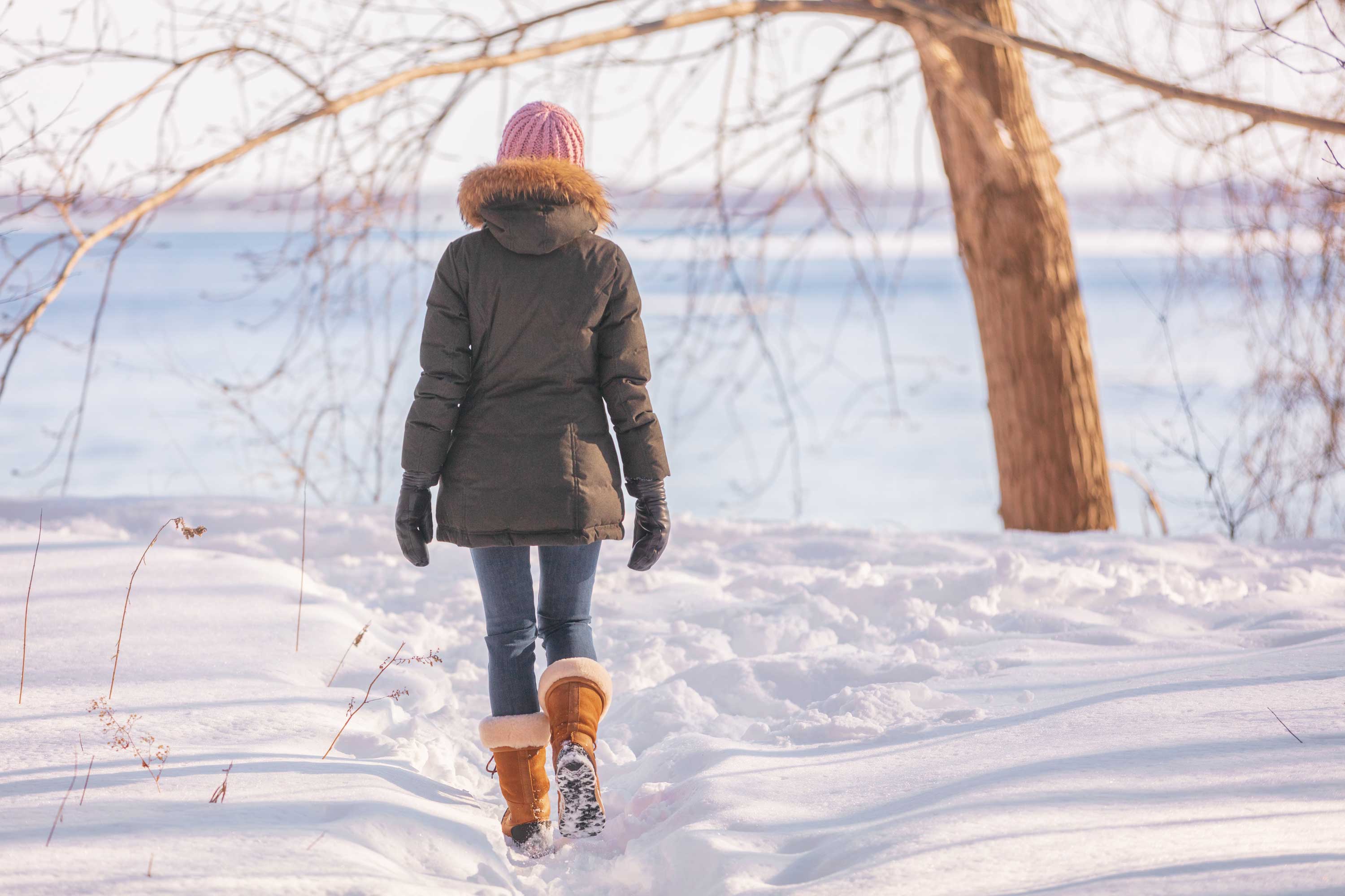 A woman hiking in the snow.