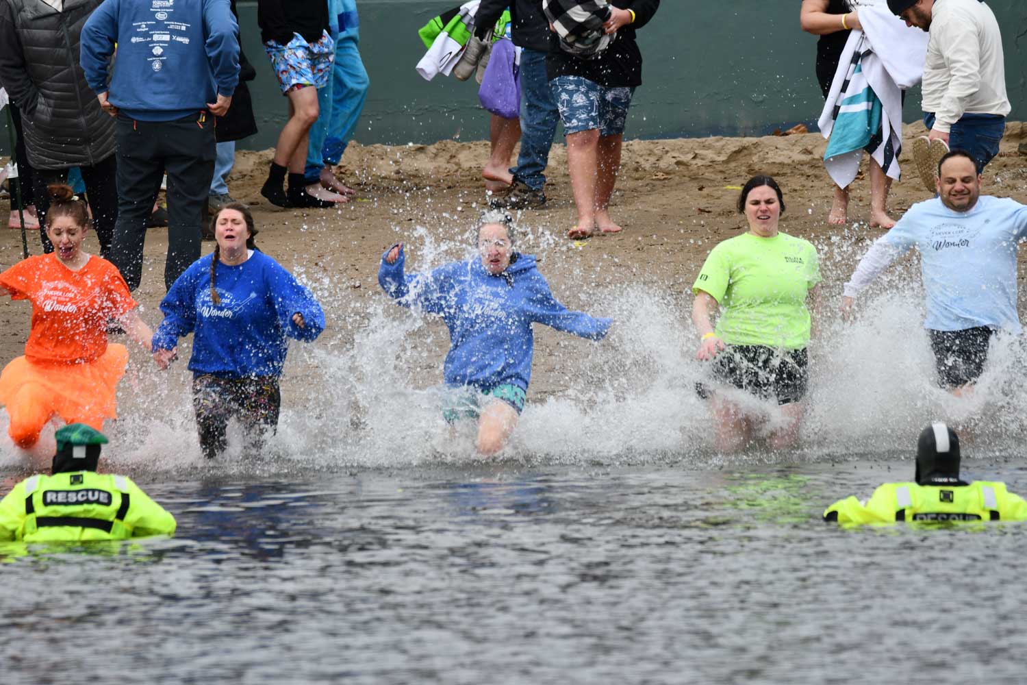 People dive into water
