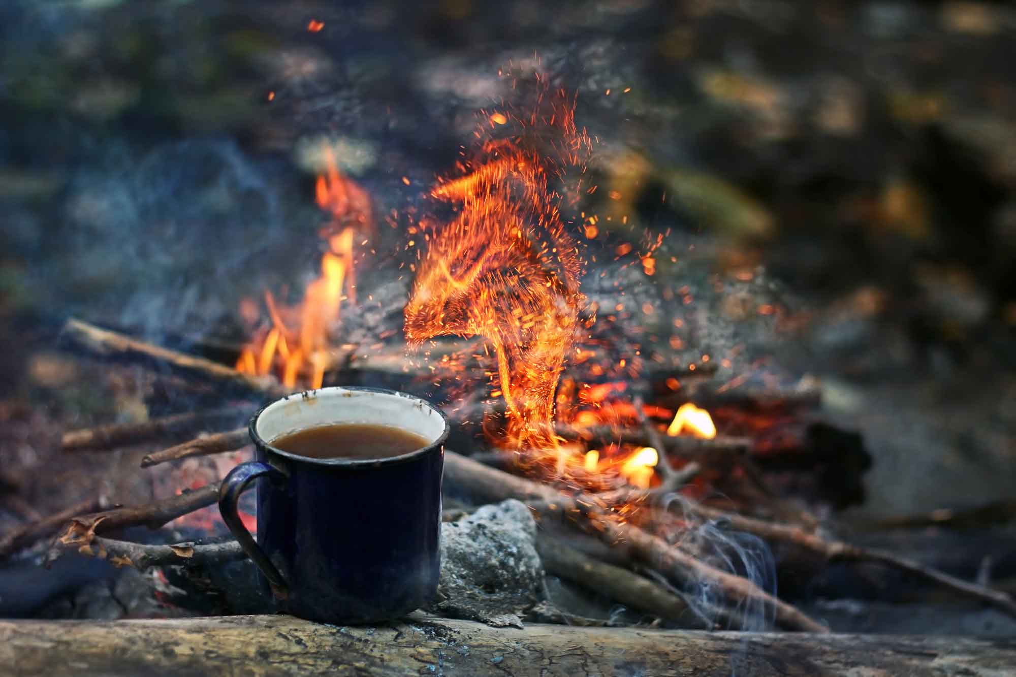a mug of coffee on a fire