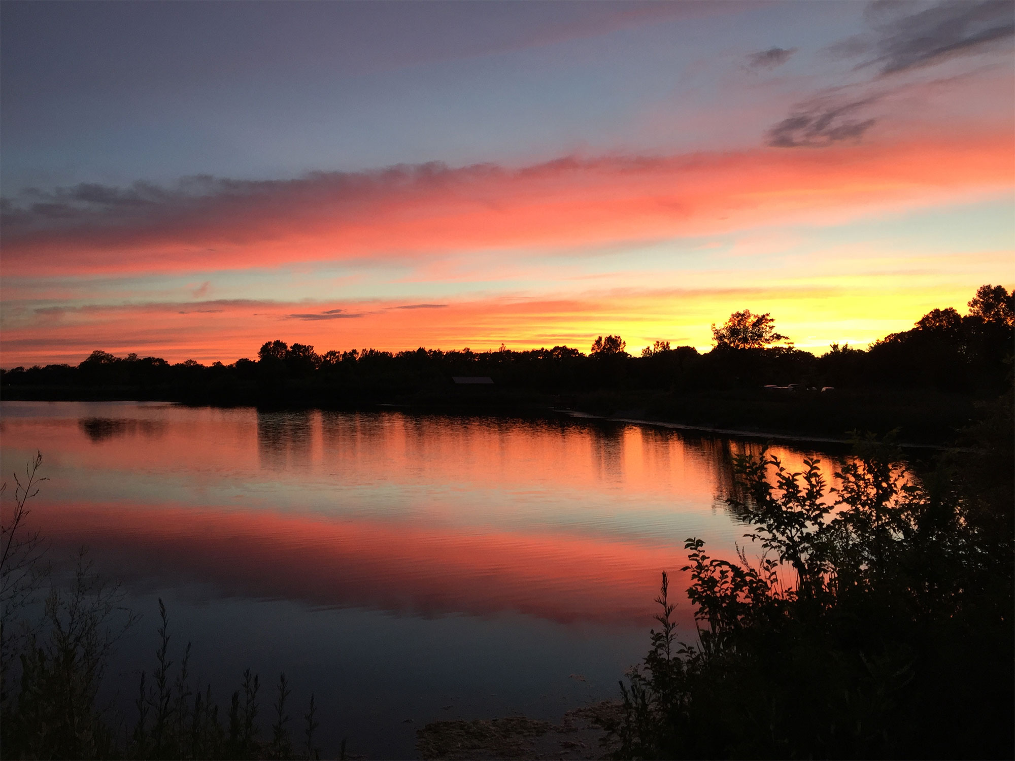 A view of the lake at sunset.