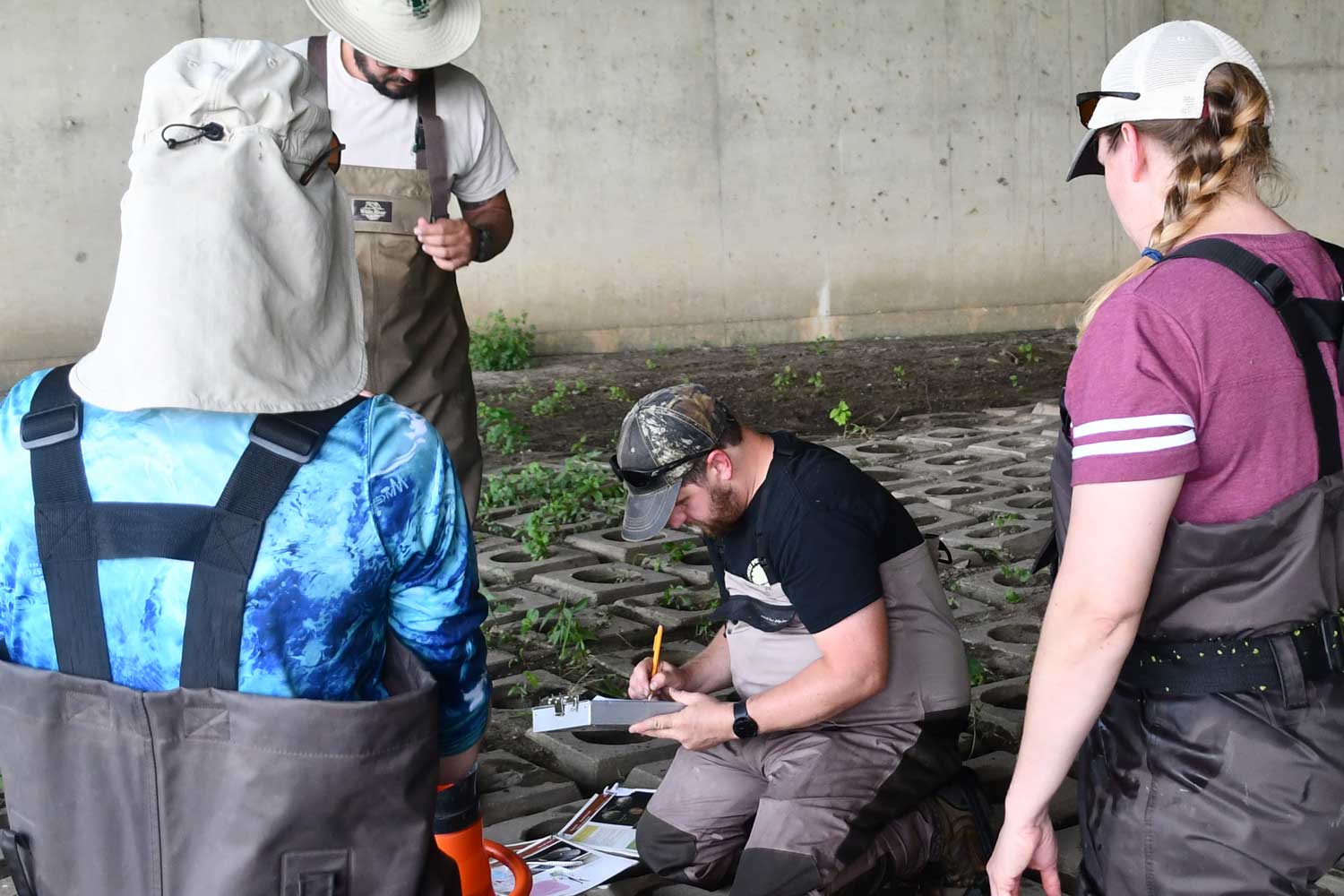 Group of people documenting data and information.