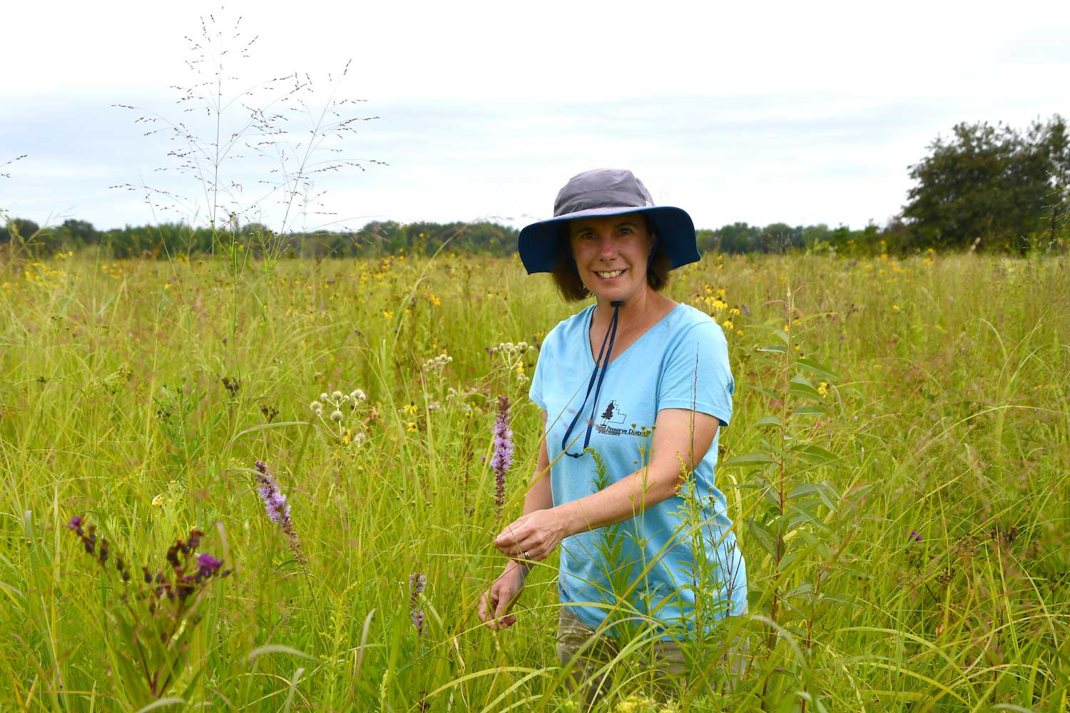 A woman standing in a prairie