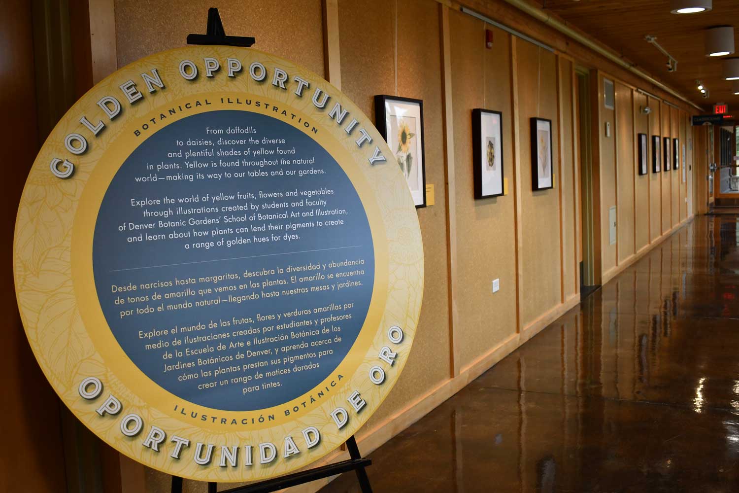 Exhibit description sign near a photo.