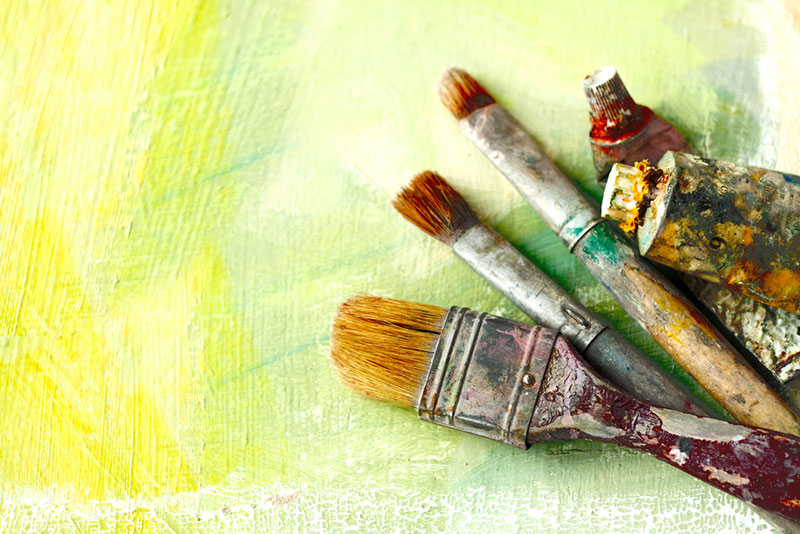 Paint brushes on a canvas.