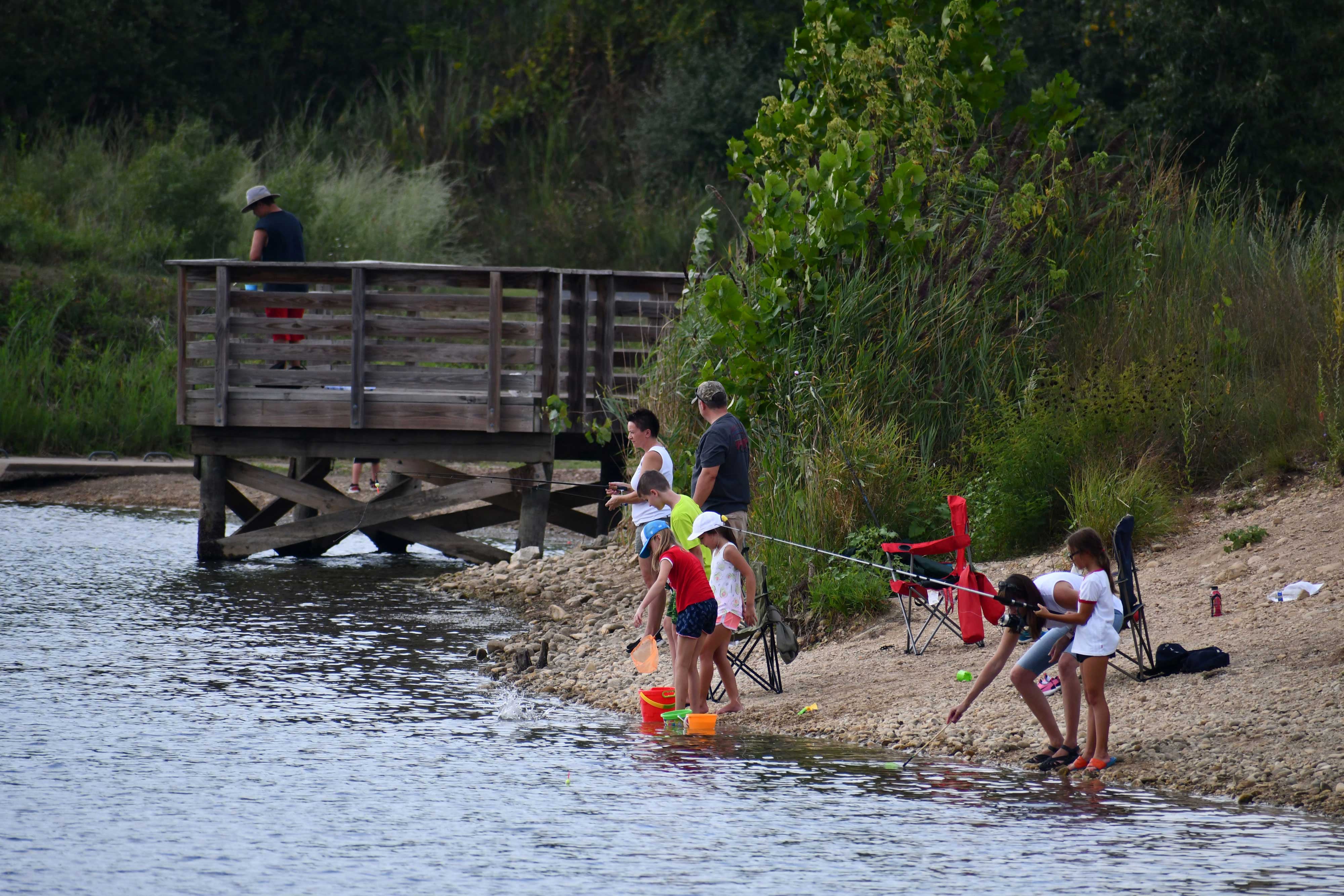 Preserve visitors fishing along the shore.