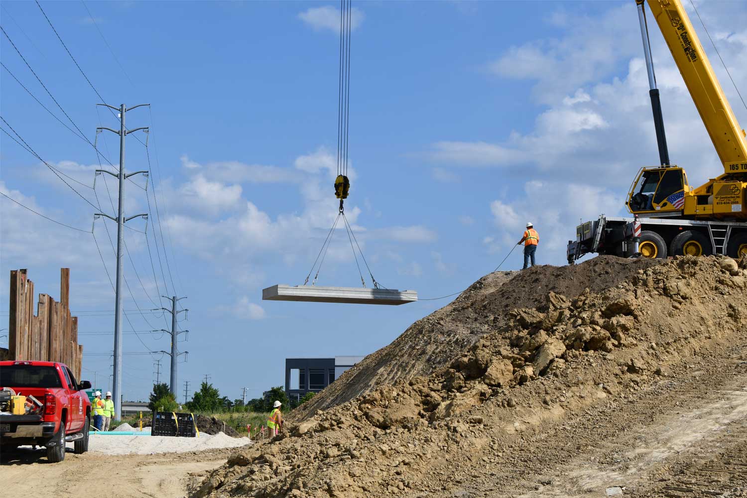 Crews install large concrete base for pedestrian tunnel