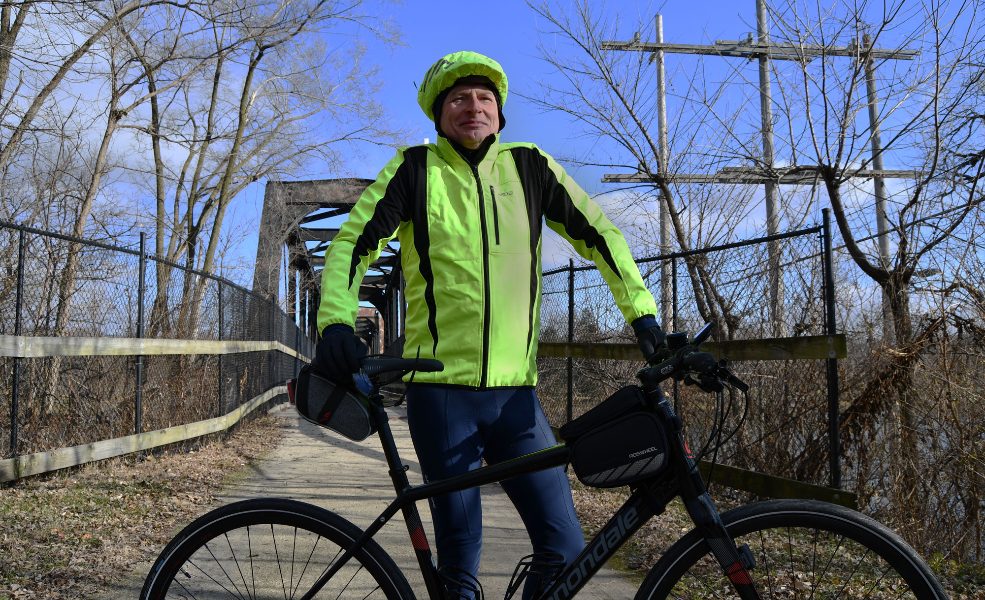 Man on a trail with his bike