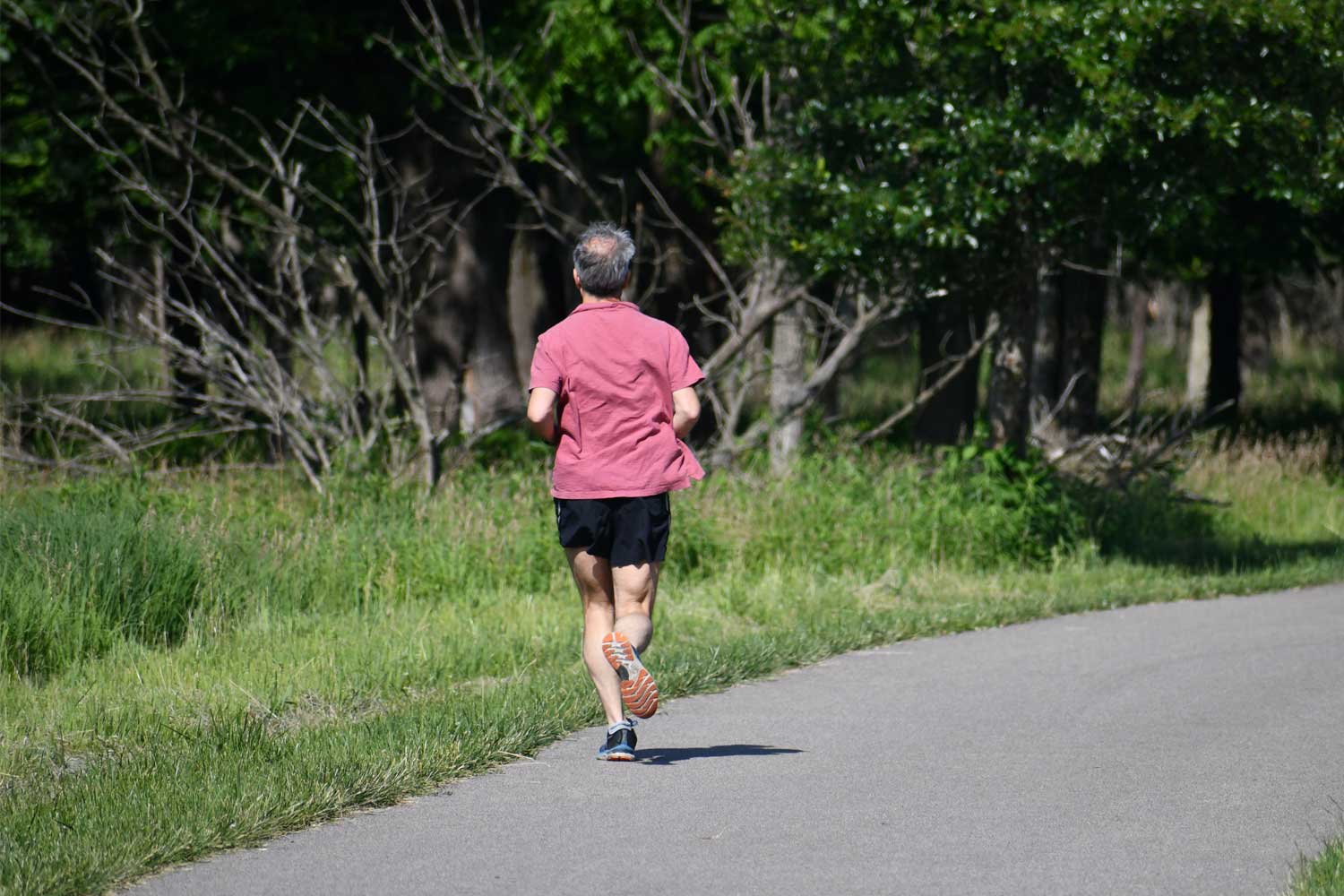 Person running on a paved trail.