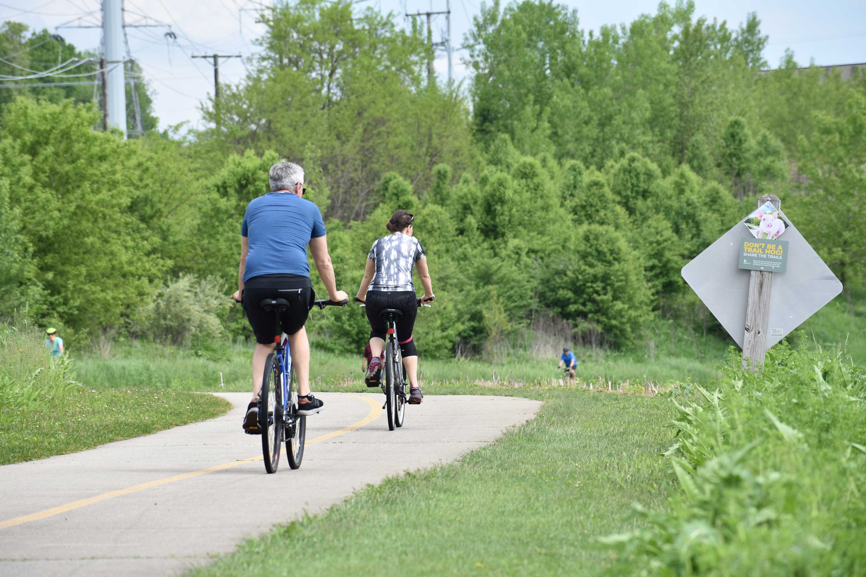 Cyclists on a bike trail at Whalon Lake