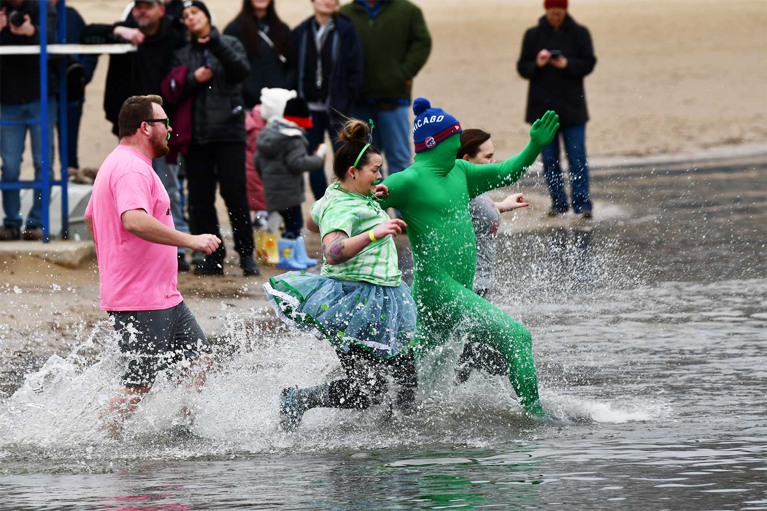 People splash into the water during the Polar Plunge.
