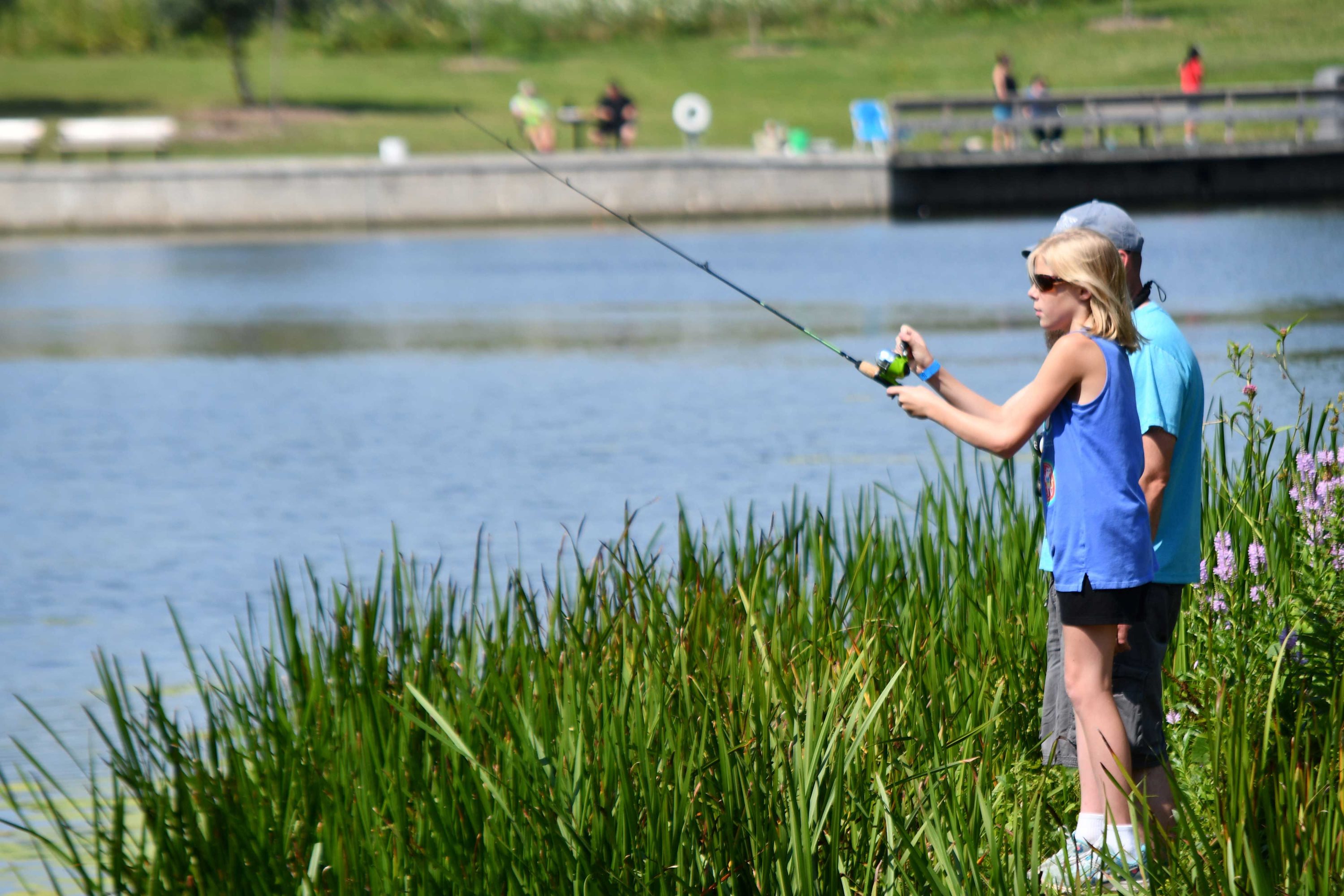 Preserve visitor fishing along the shoreline at Monee Reservoir.
