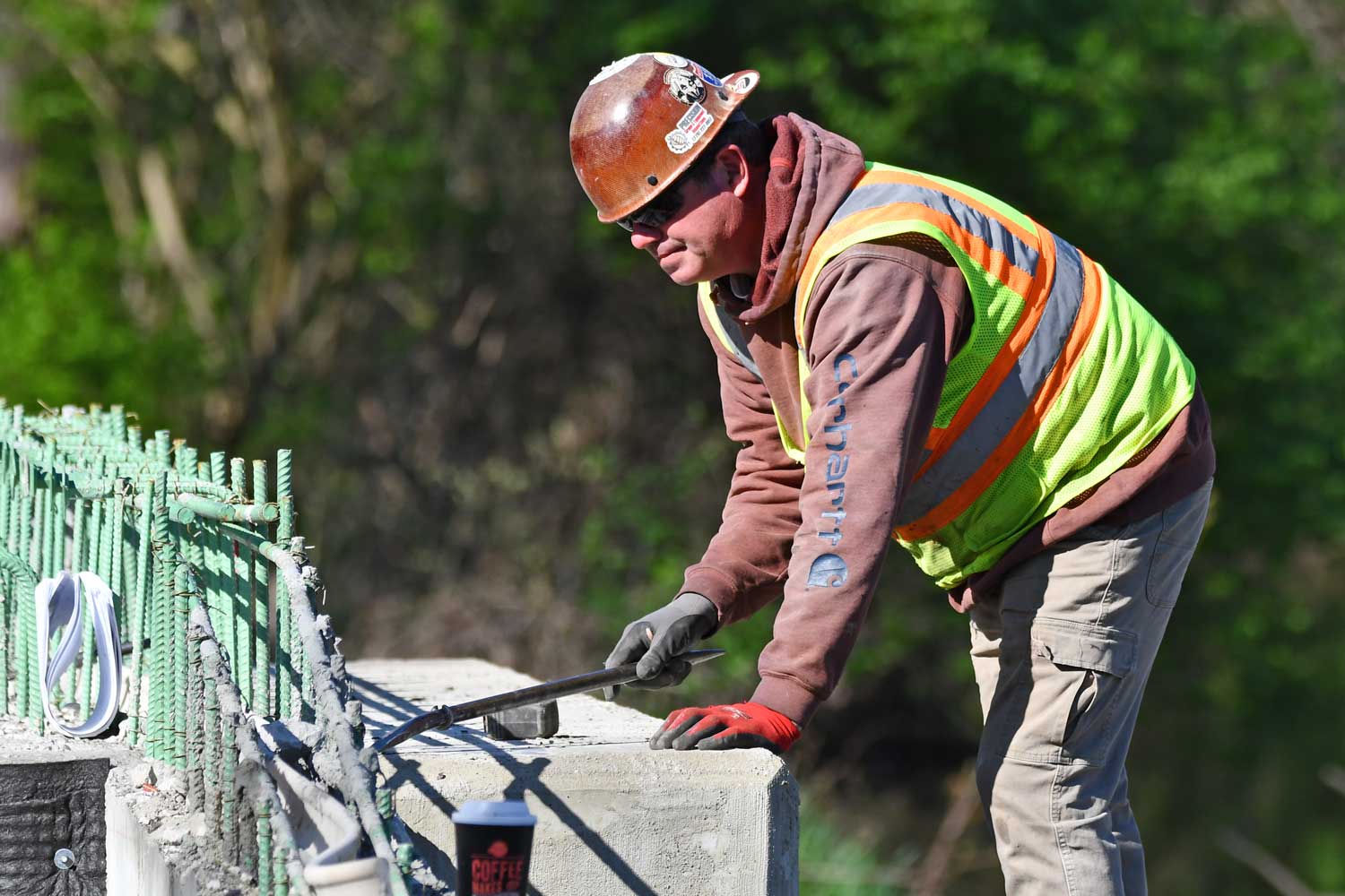 Construction worker working on bridge.