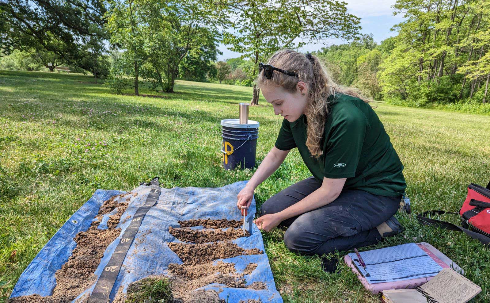 Roz Remsen collecting soil samples.
