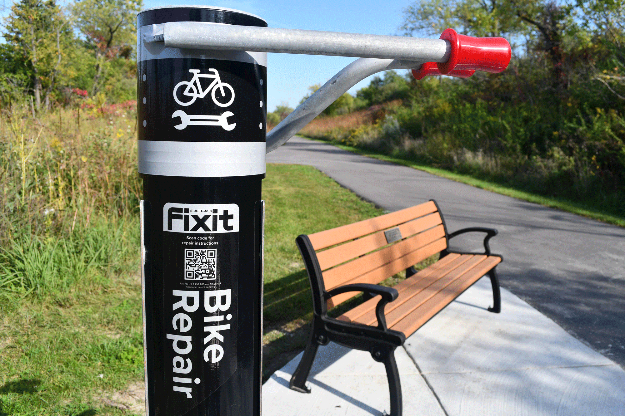 A Forest Preserve bike repair station along a trail.