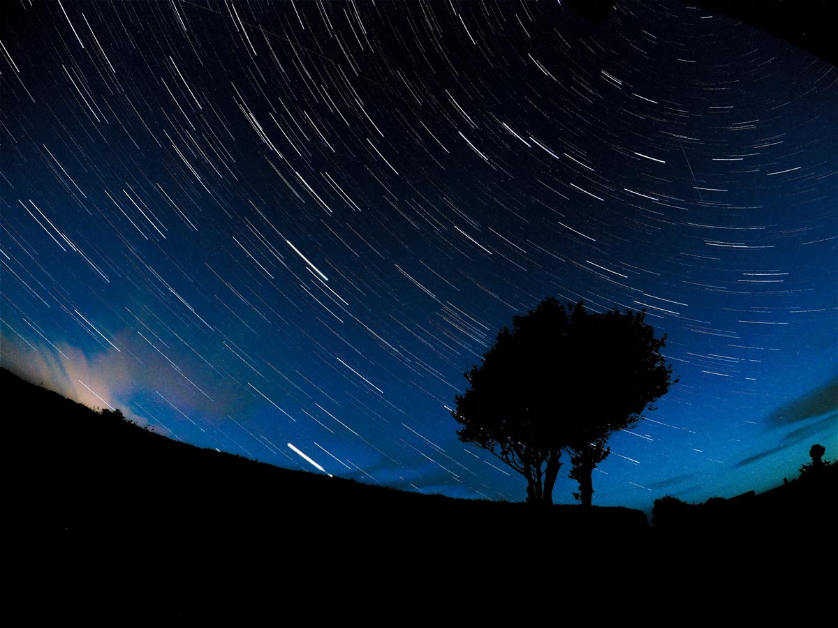 Meteors streaking across the night sky