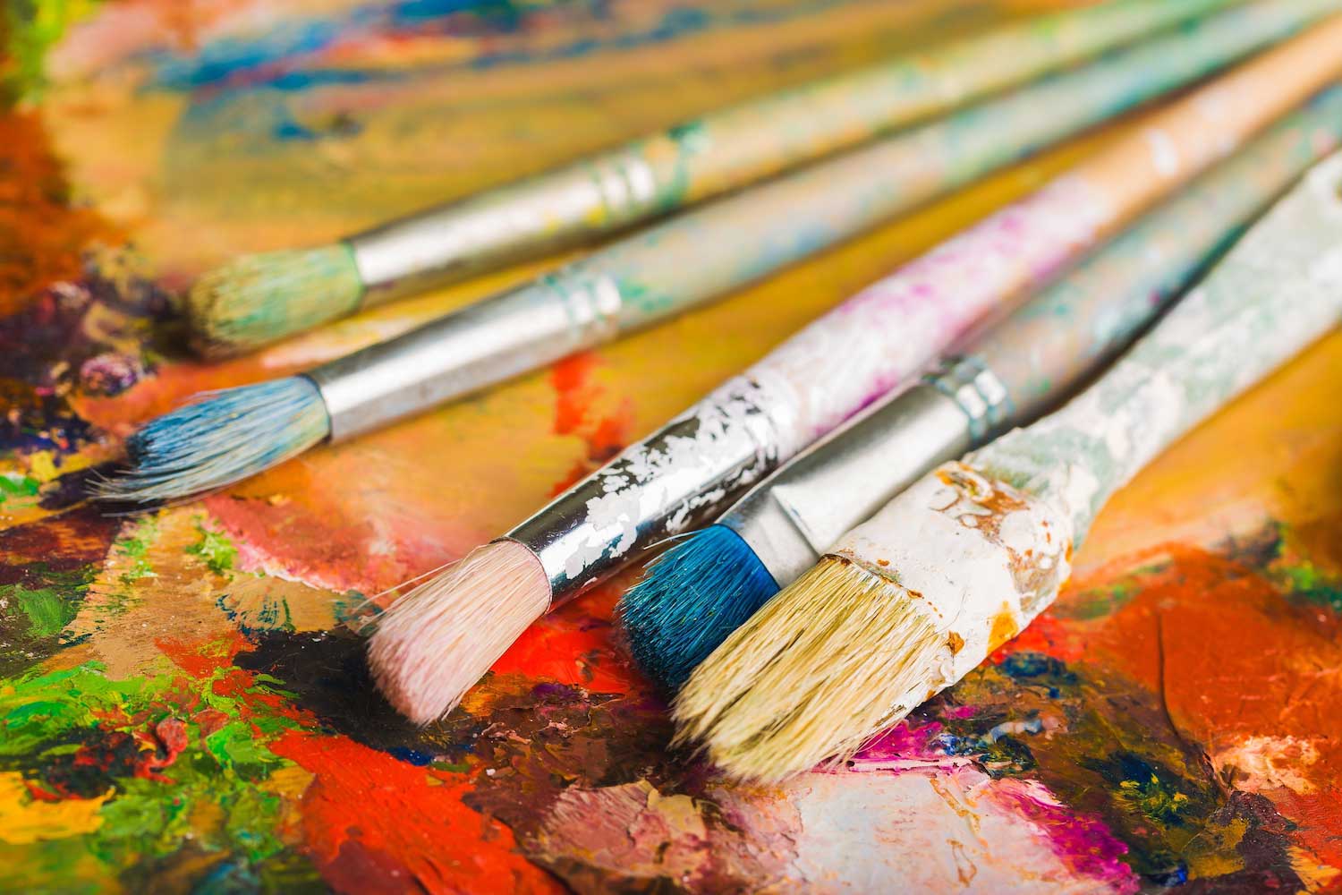 Paint brushes on a palette.