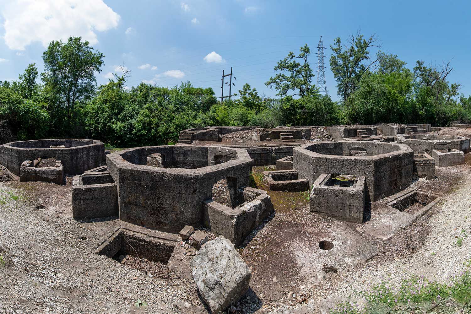 Concrete forms in the ground on the site on an old steel mill.