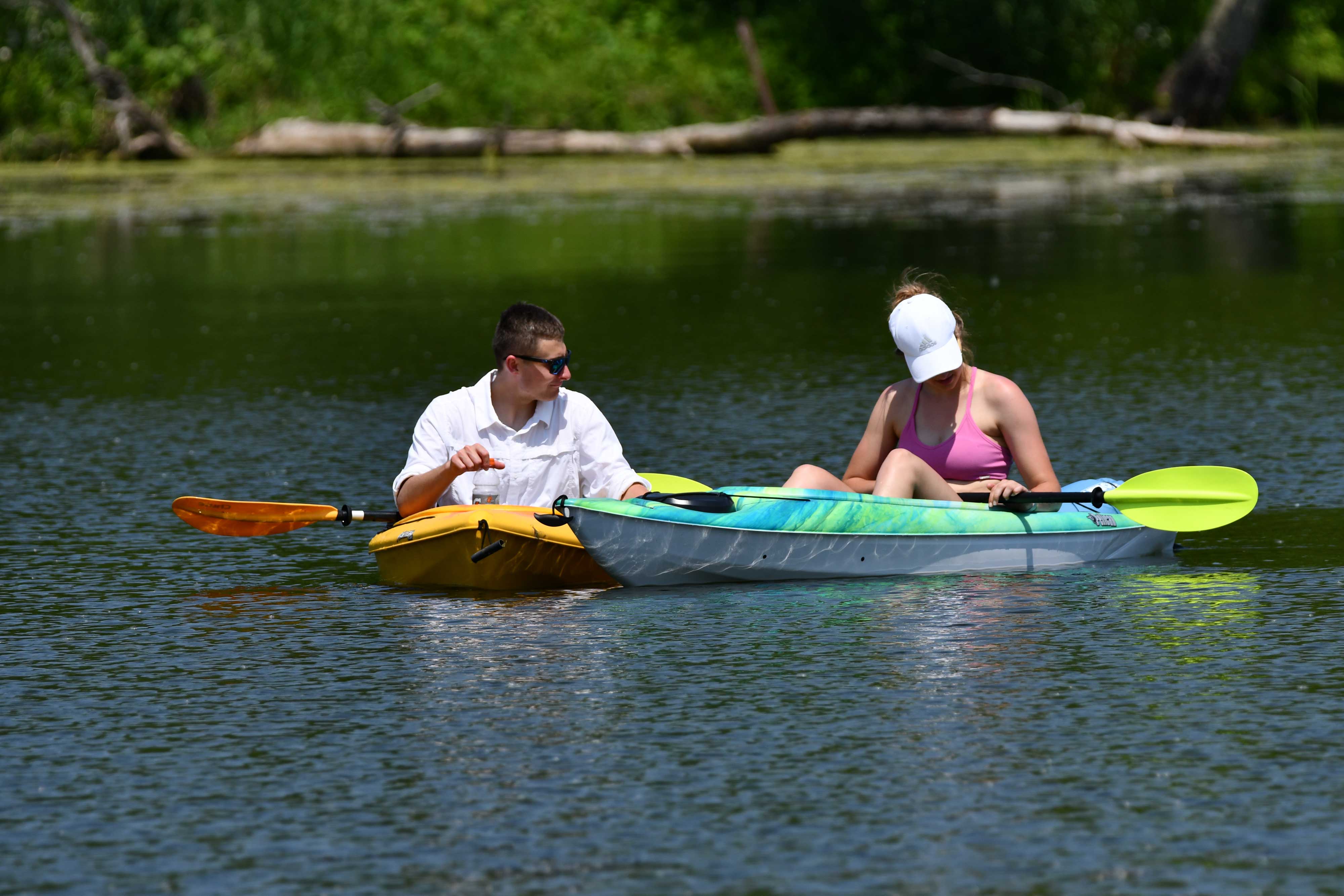 Two people in a kayak on the water.