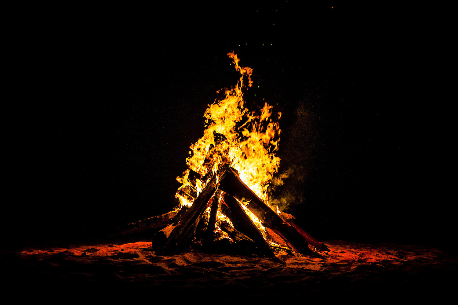 A campfire at night.