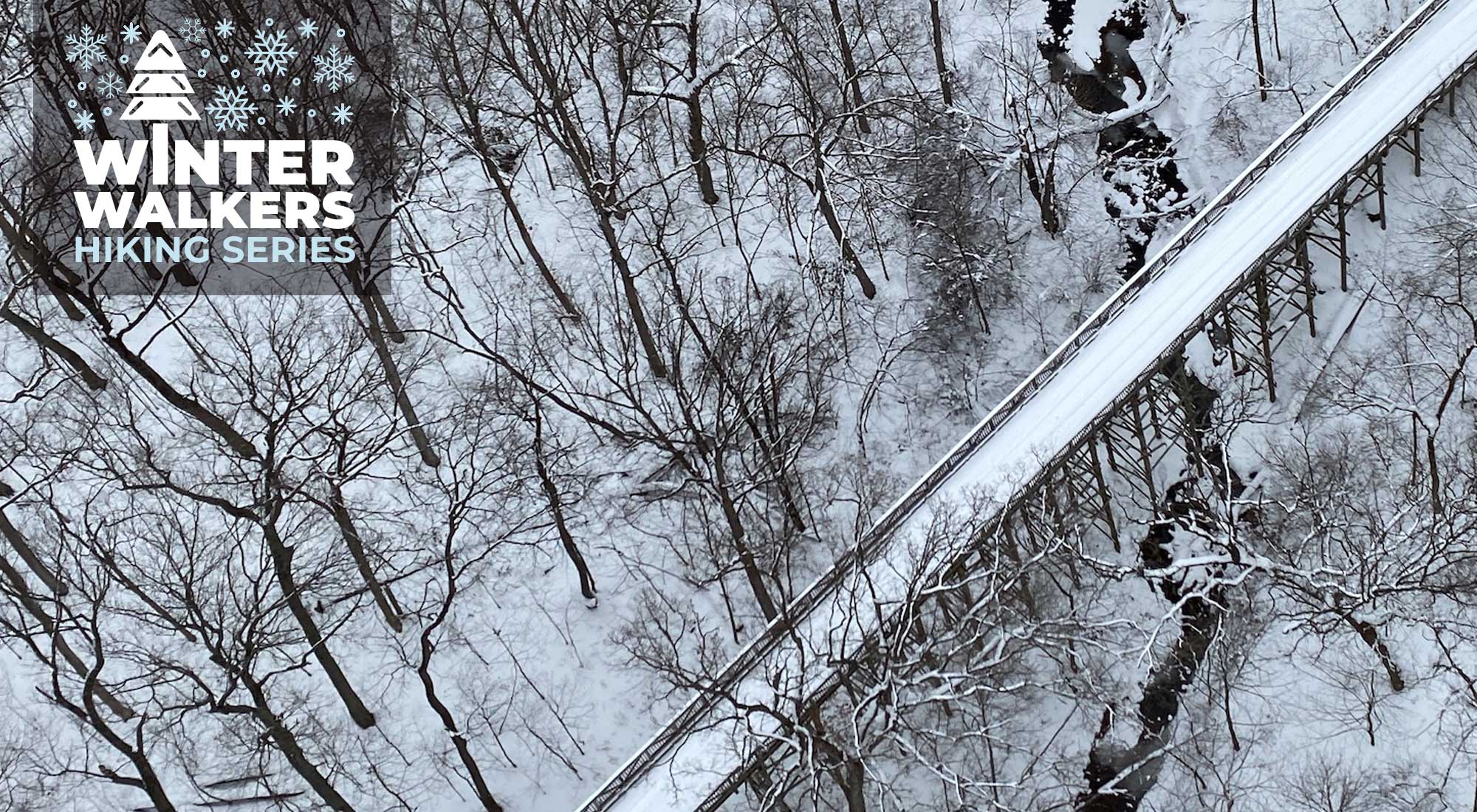 An aerial view of a snow-covered bridge.