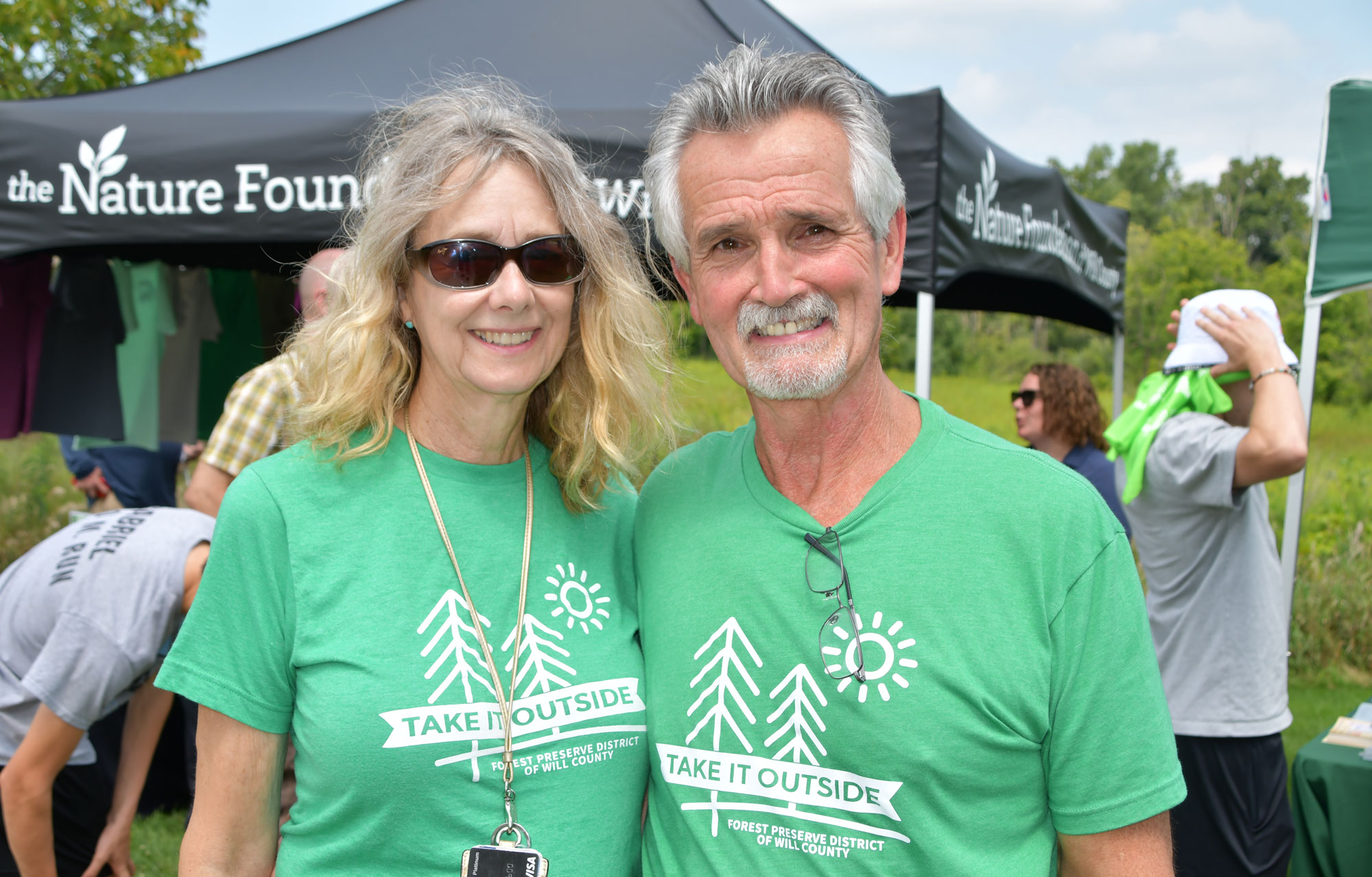 A man and woman pose for a photo.