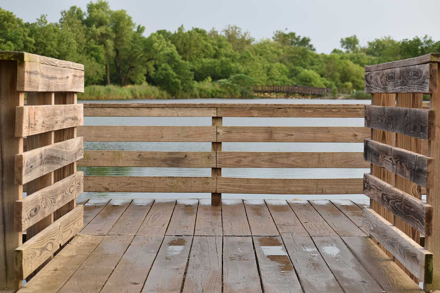 A wooden deck over a lake. 