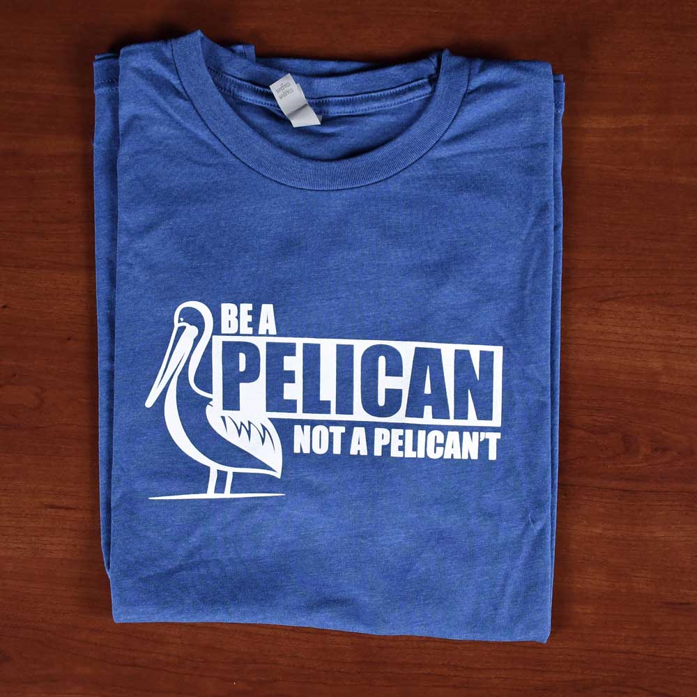 blue shirt that says be a pelican, not a pelican't