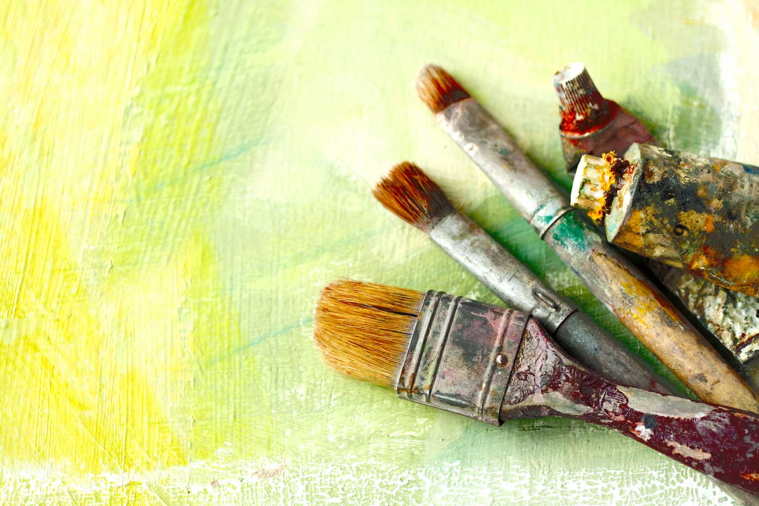 Paint brushes on a watercolor.