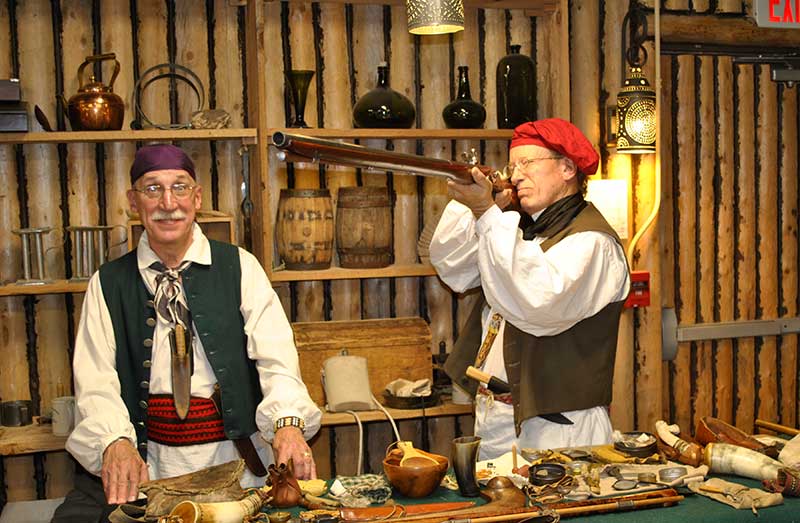 Two people dressed in 18th-century clothing.